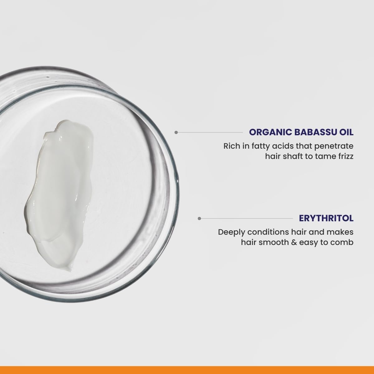 Jar of organic babassu oil with text on a gray background