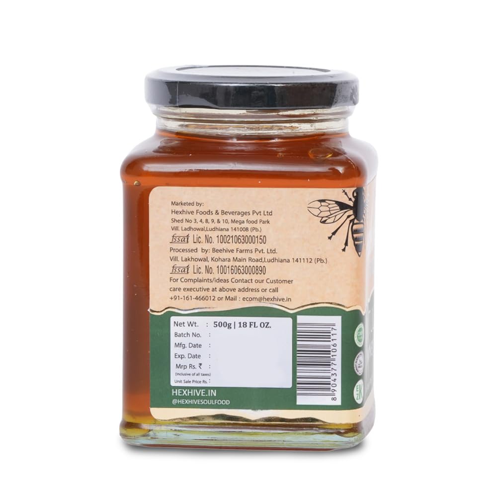 Jar of honey with a label on a white background