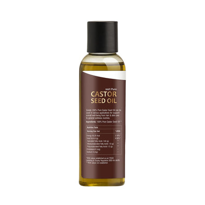 Bottle of castor seed oil on a white background