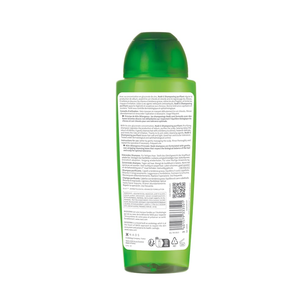 Green bottle with label on a white background