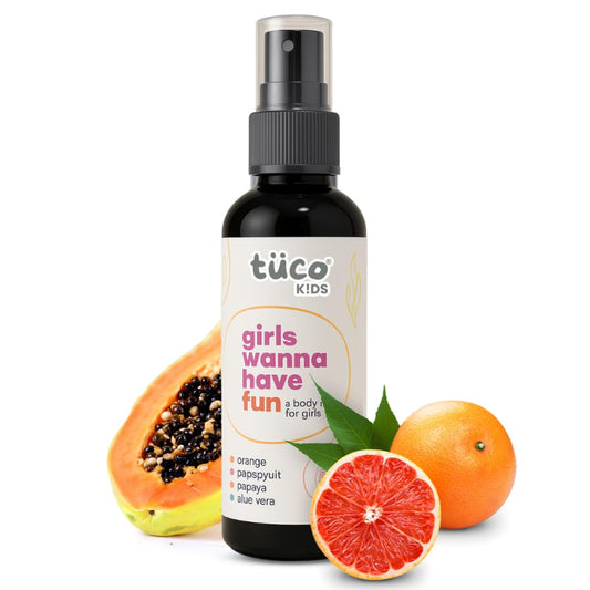 Bottle of tüco Kids product with papaya, grapefruit, and orange on a white background