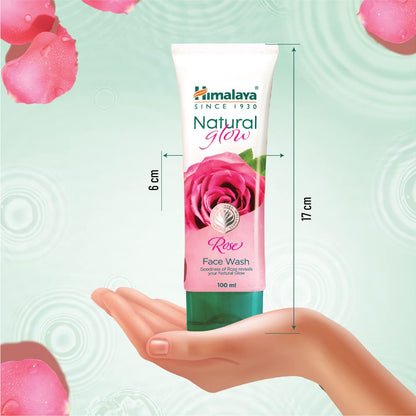 Himalaya Natural Glow Rose Face Wash tube with dimensions on a hand and rose petal background