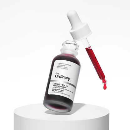 Skincare serum bottle with dropper on a white background, featuring 'The Ordinary' brand.