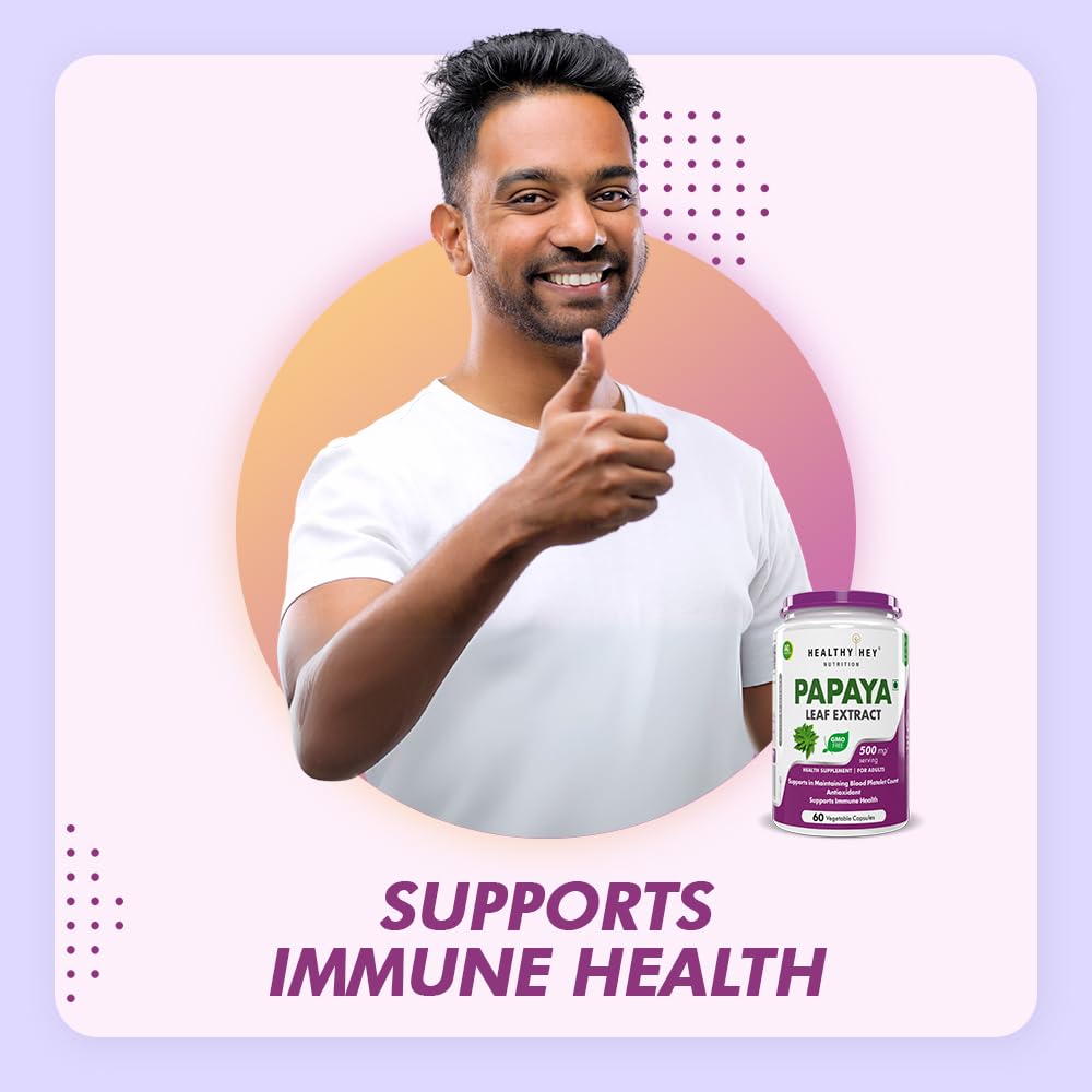 Man giving a thumbs up with a bottle of papaya leaf extract supplement on a light purple background