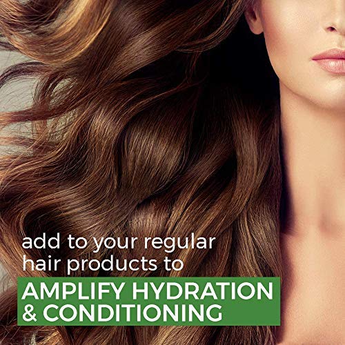 Close-up of a woman's face with wavy brown hair, promoting hair product amplification.