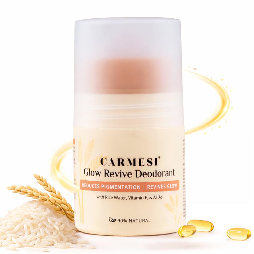 Carmesi Glow Revive Deodorant with rice grains and oil droplets on a white background