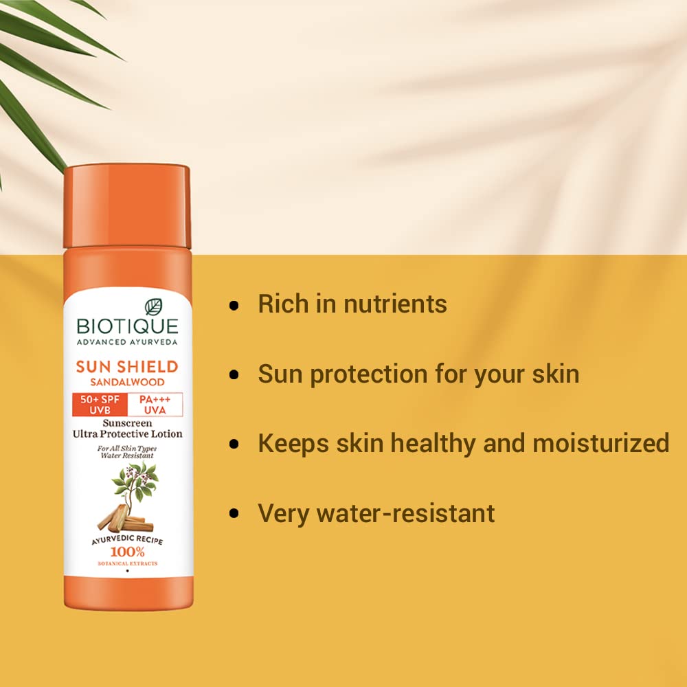 Biotique Sun Shield Sandalwood sunscreen lotion bottle with product features on a yellow background
