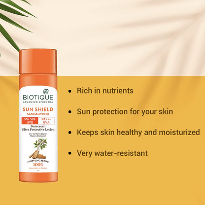 Biotique Sun Shield Sandalwood sunscreen lotion bottle with product features on a yellow background