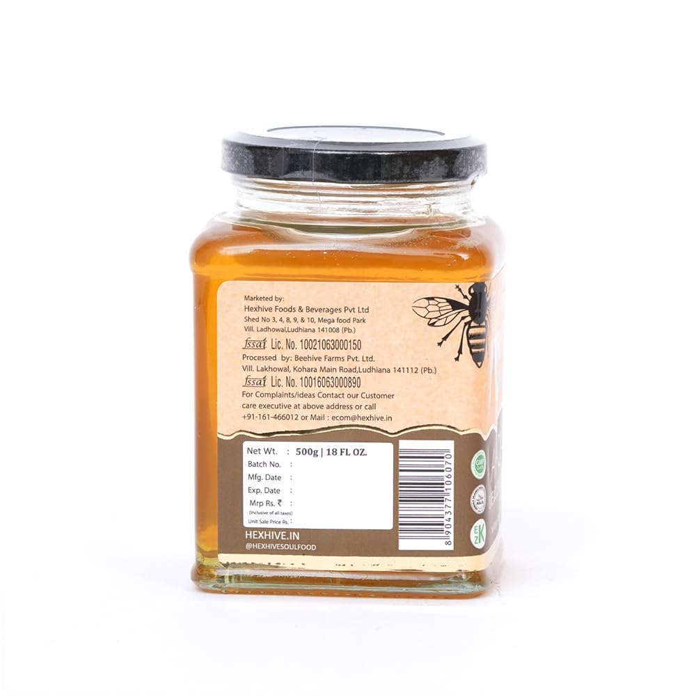 Jar of honey with a label on a white background