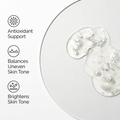 Skincare product with bubbles on a white background, featuring text on antioxidant support, skin tone balancing, and brightening.