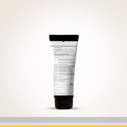 Tube of cream with a black cap on a light gray background