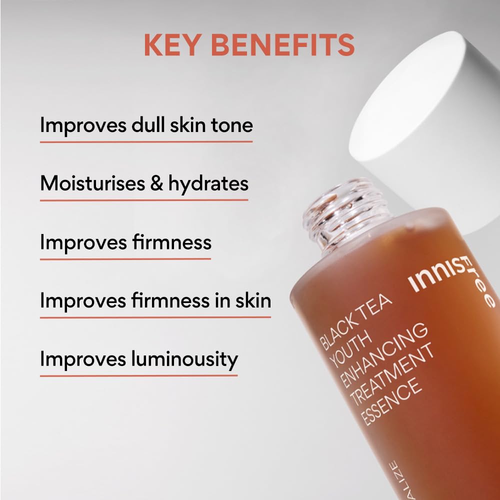 Innisfree Black Tea Youth Enhancing Treatment Essence bottle with key benefits listed on a gray background