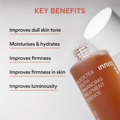 Innisfree Black Tea Youth Enhancing Treatment Essence bottle with key benefits listed on a gray background