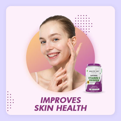 Woman touching her face with a bottle of Healthy Day Natural Vitamin E supplement on a light purple background.