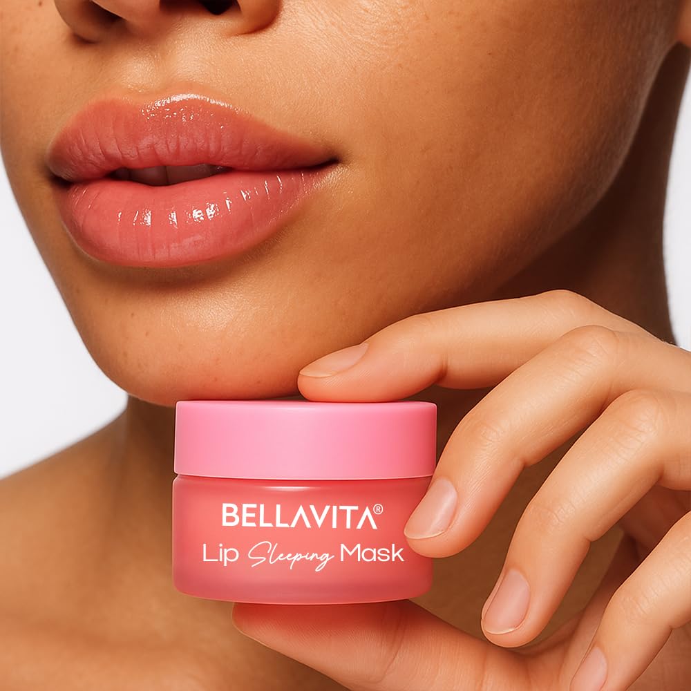 Person holding a pink Bellavita lip sleeping mask jar close to their lips.