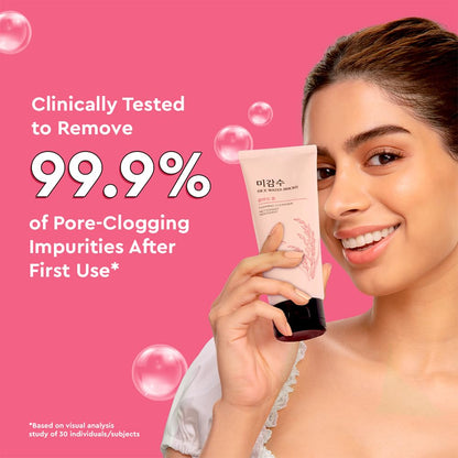 Woman holding a skincare product with text claiming 99.9% pore-clogging impurity removal on a pink background