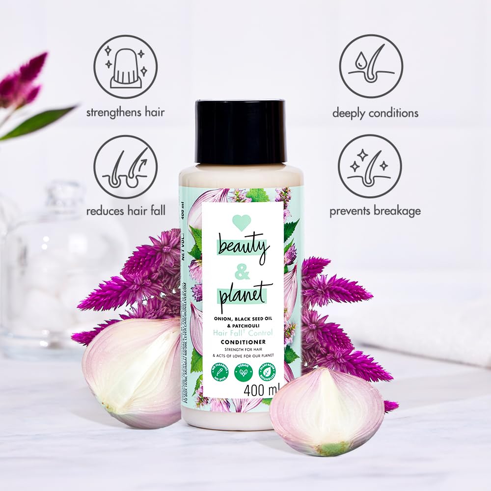 Beauty & Planet conditioner bottle with floral design on a light background
