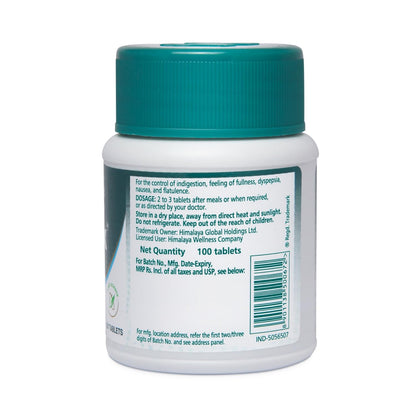 Back view of a white pill bottle with a green cap on a white background