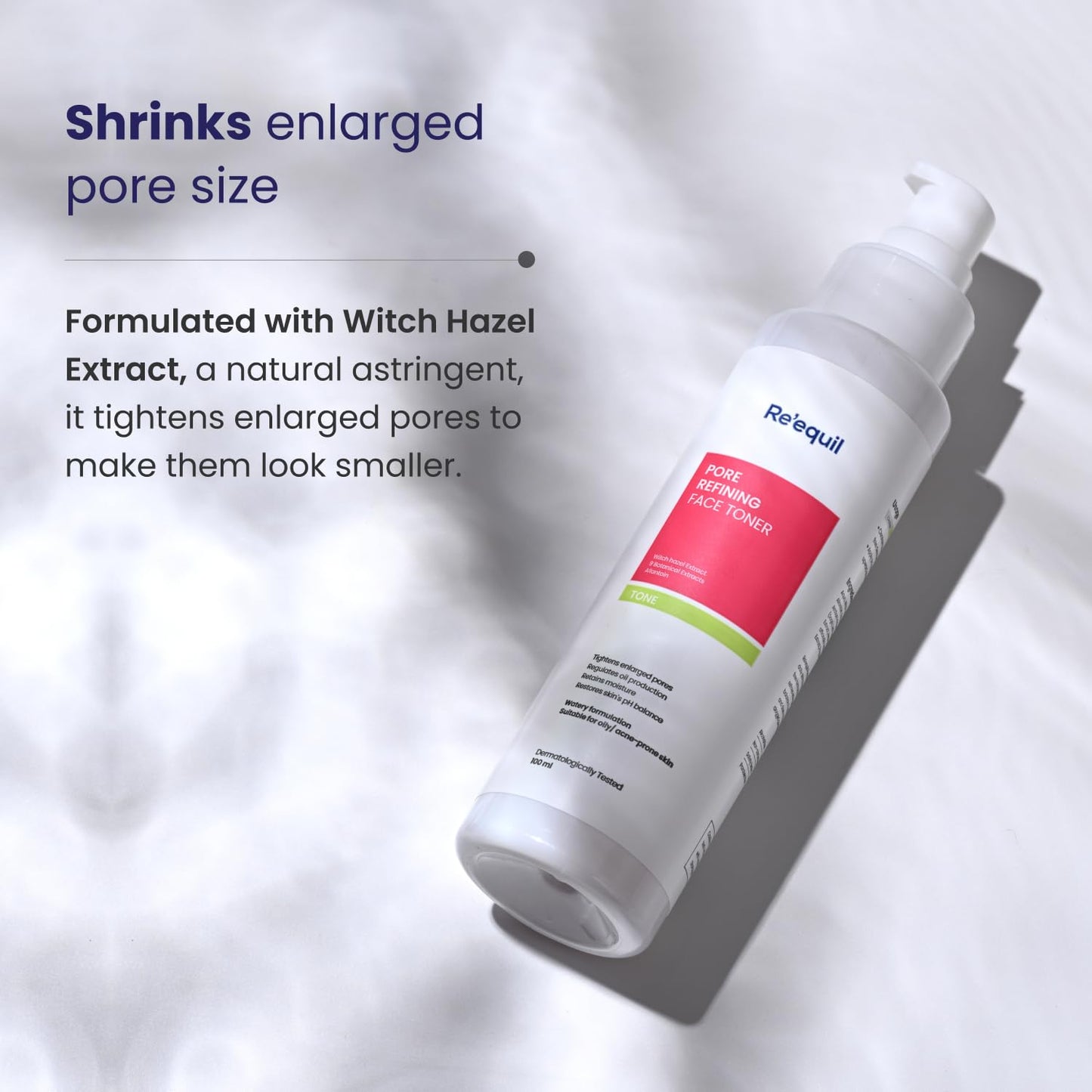 Skincare product bottle with text about pore shrinking properties on a light background