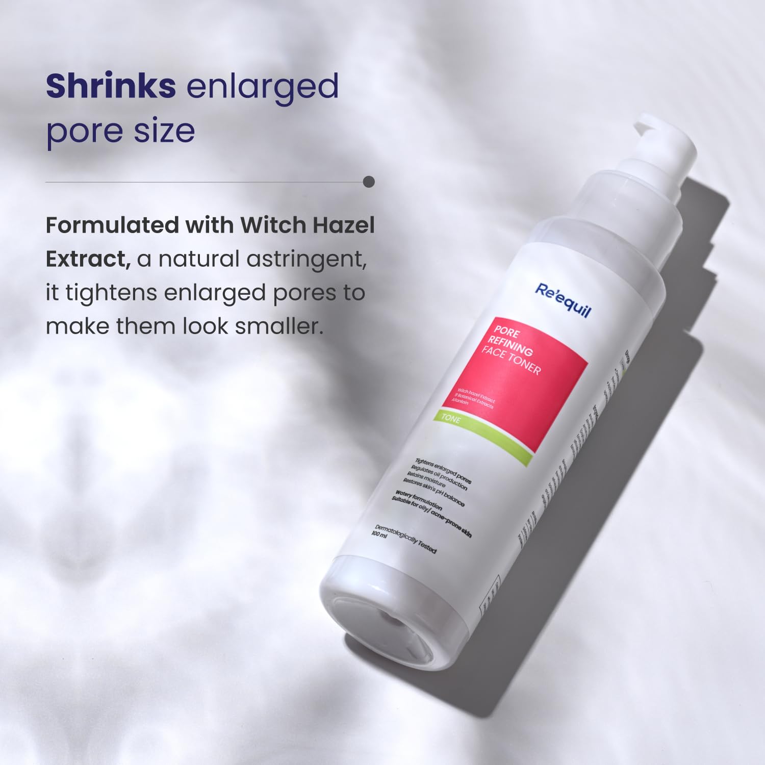 Skincare product bottle with text about pore shrinking properties on a light background
