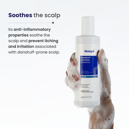 Bottle of Re'equil shampoo held by a hand with text about scalp soothing properties.