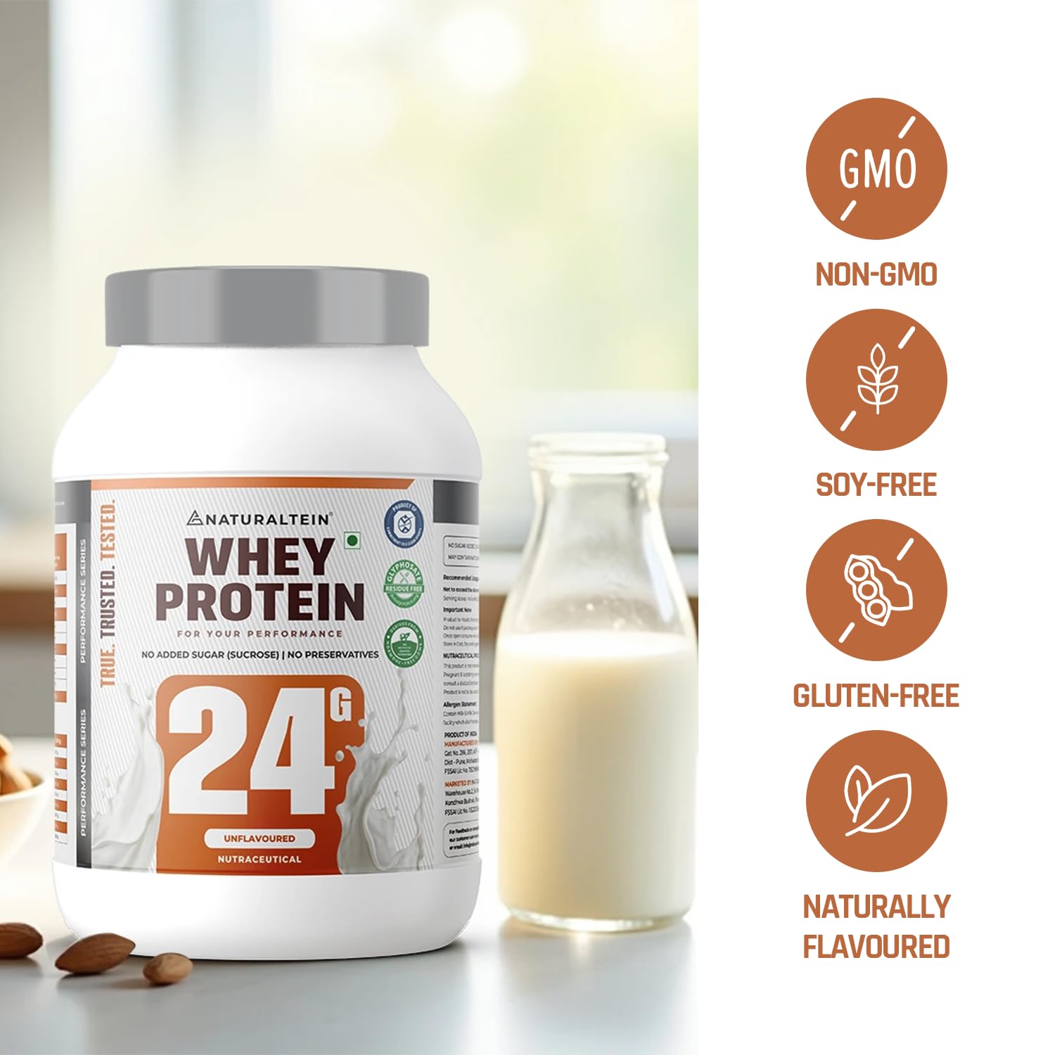 Whey protein container with a glass of milk and almonds on a blurred background