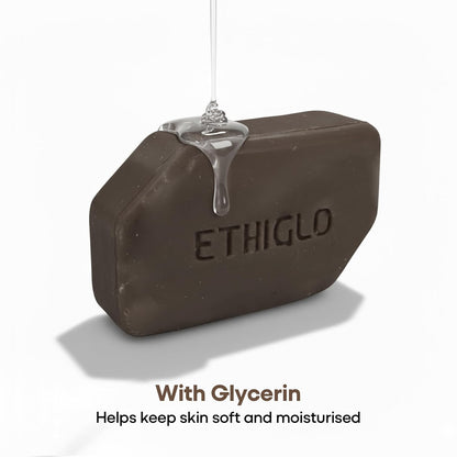 Bar of soap with 'ETHIGLO' branding, dripping with glycerin, on a white background.