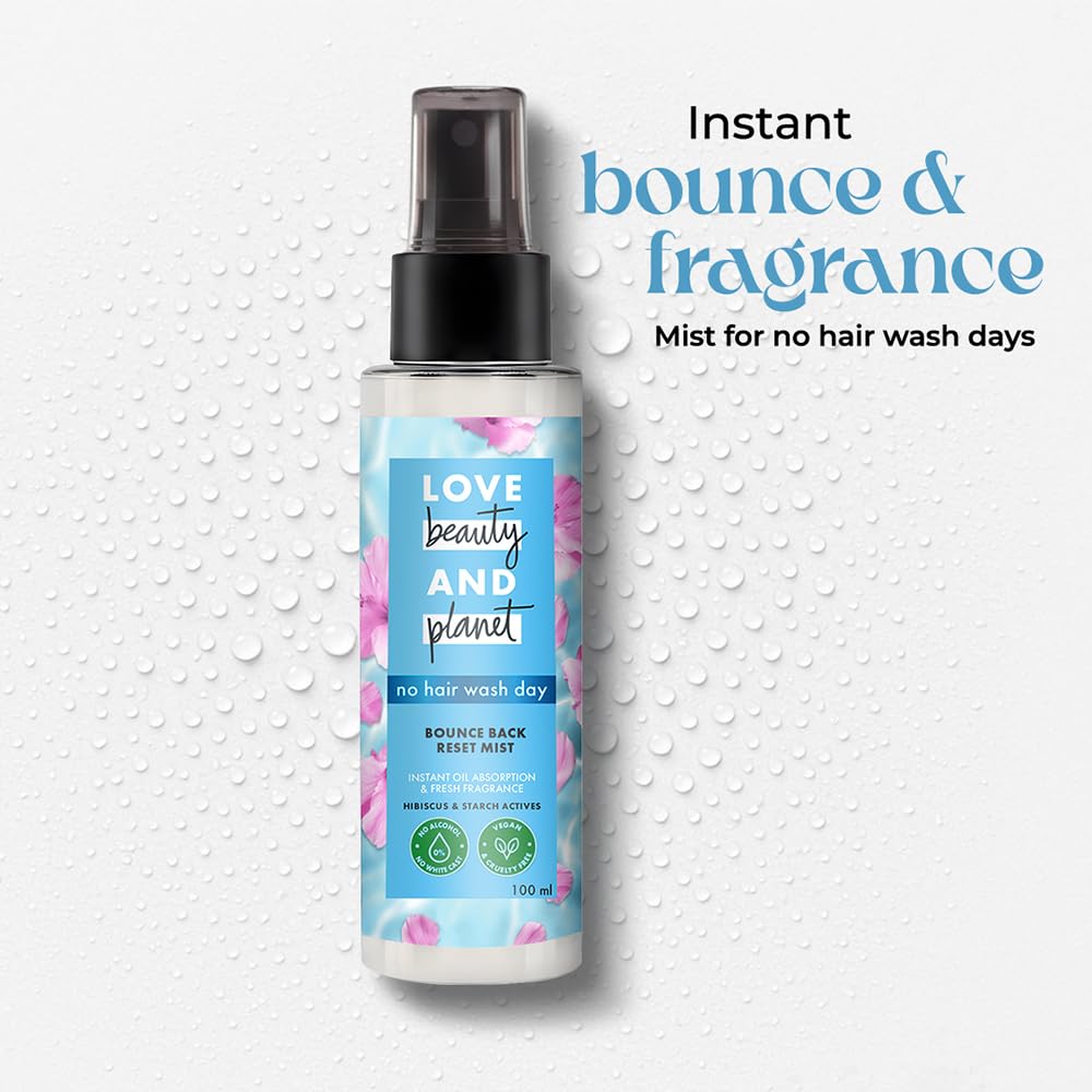 Spray bottle labeled 'Love Beauty and Planet' on a textured white background