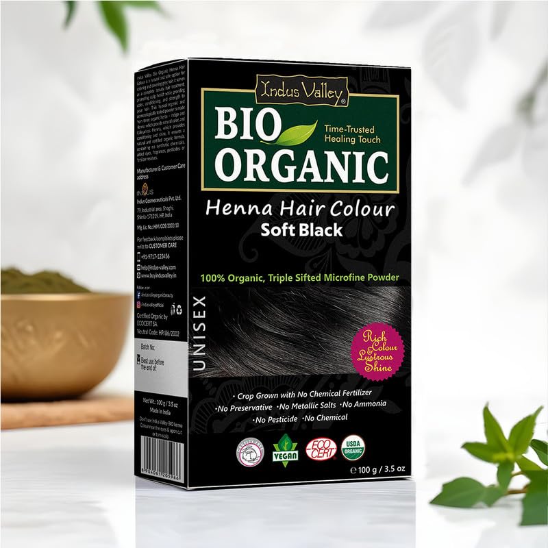 Box of Indus Valley Bio Organic Henna Hair Colour in Soft Black on a white background with greenery.