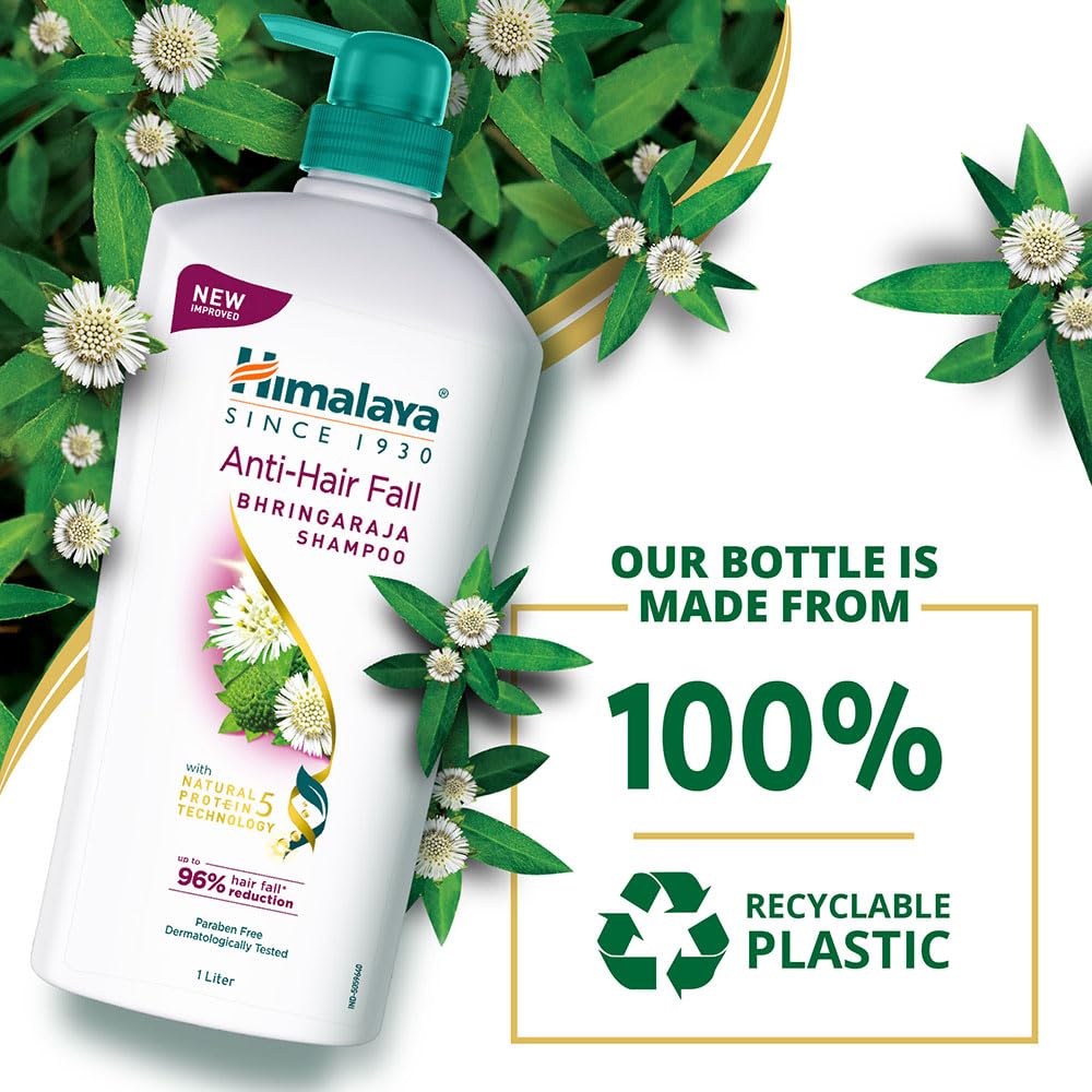 Himalaya Anti-Hair Fall Shampoo bottle with green leaves and flowers on a white background