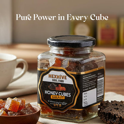 Jar of HEXHIVE Soul Food Honey Cubes Shilajit on a table with a cup and bowl.