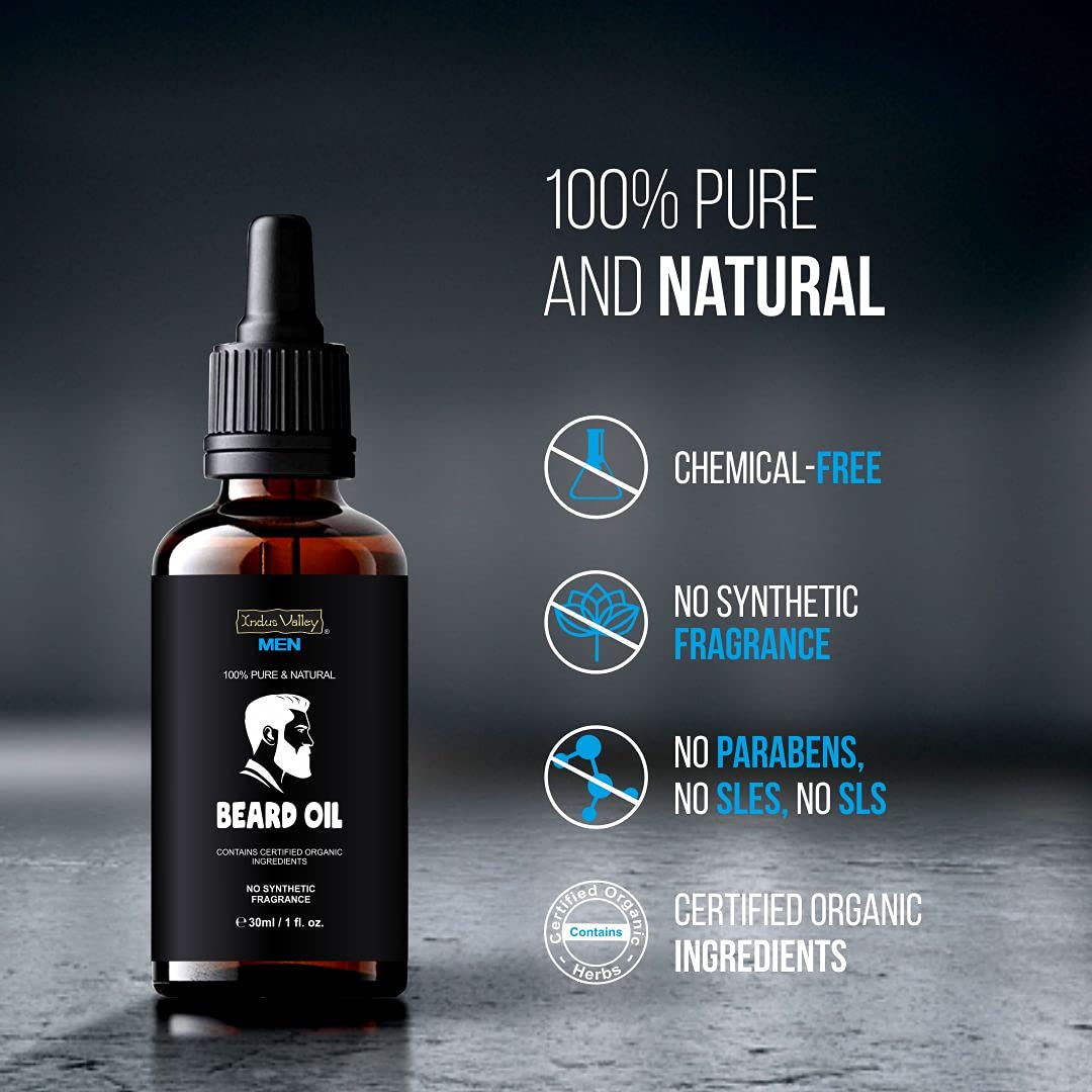 Bottle of beard oil with certification labels on a dark background