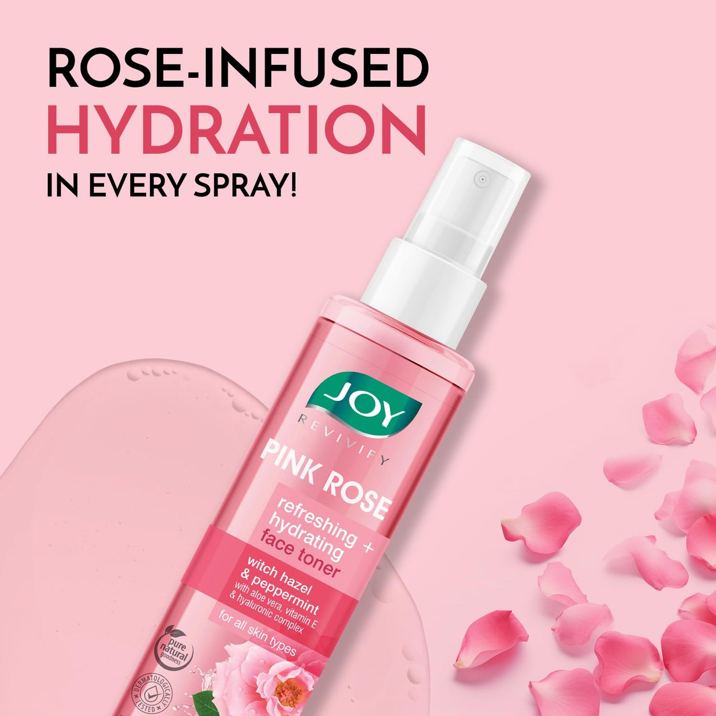 Pink rose facial toner spray with rose petals on a pink background