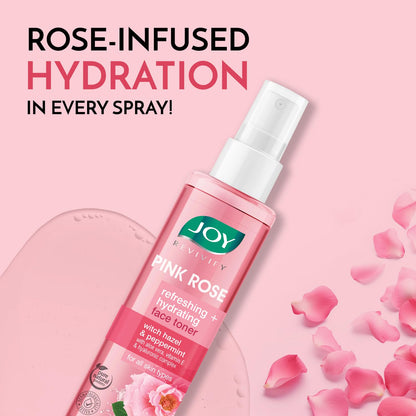 Pink rose facial toner spray with rose petals on a pink background