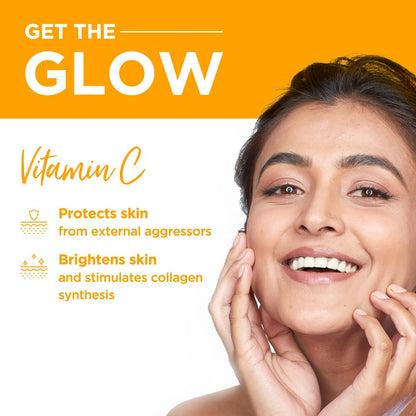 Advertisement for vitamin C skincare with a woman touching her face and text about its benefits.