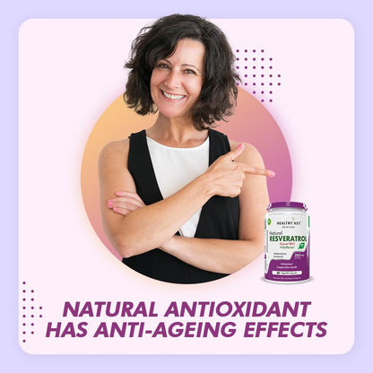 Woman pointing to a bottle of Healthy Key Resveratrol with text about natural antioxidants on a light purple background