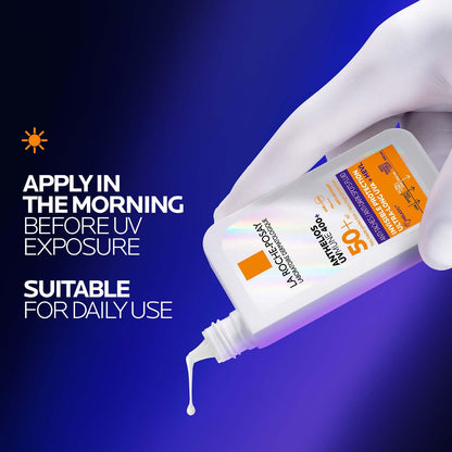 Hand applying sunscreen with a blue background and text about application.