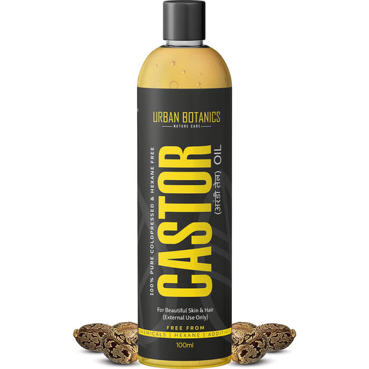 Bottle of Urban Botanics Castor oil with a black and yellow label on a white background.