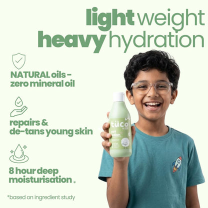 Child holding a bottle of 'tuco' product with green text and icons on a white background