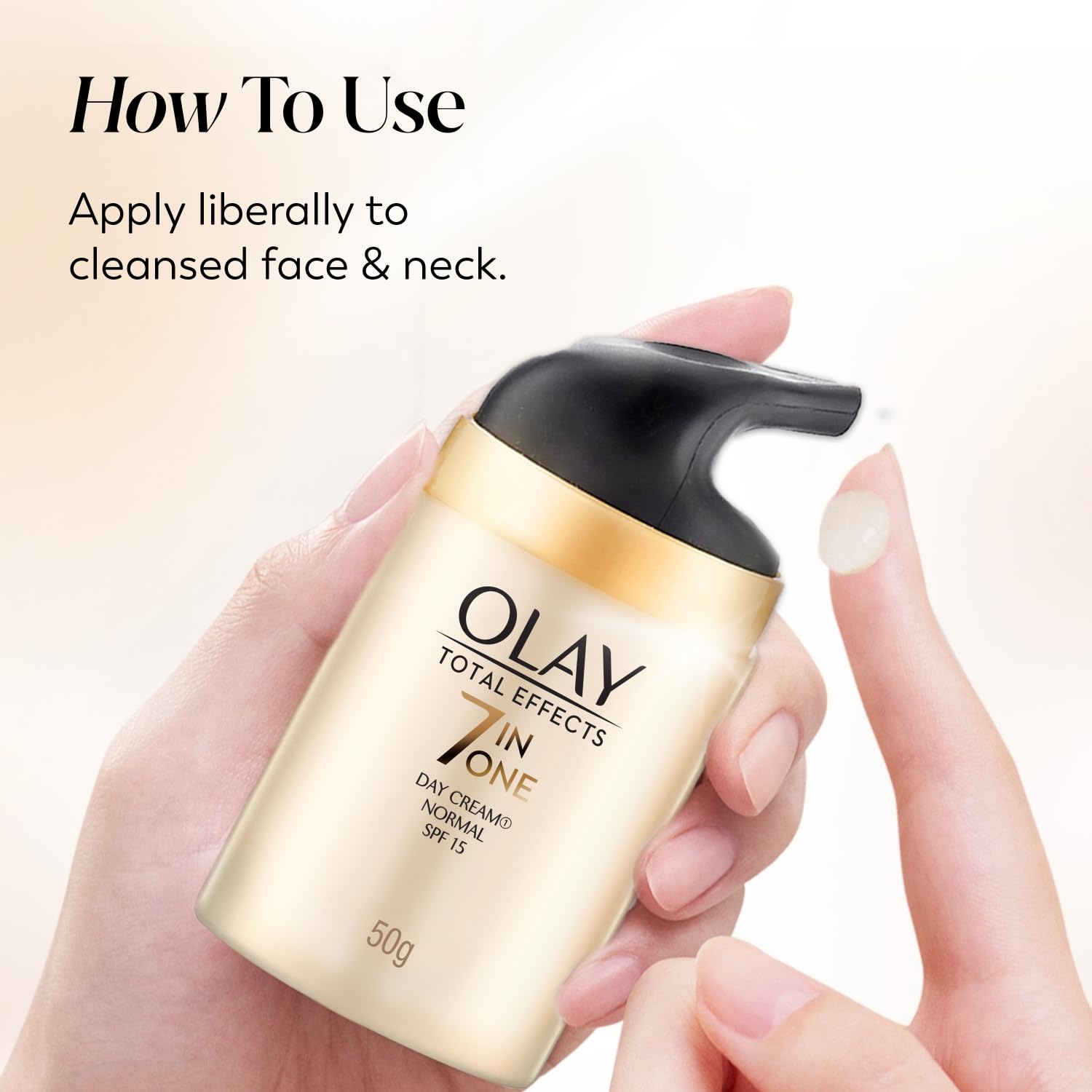 Olay Total Effects cream bottle held by a hand with application instructions.