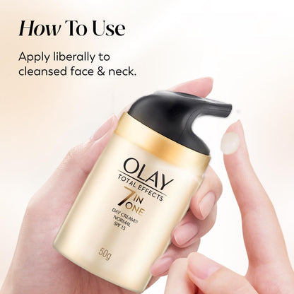 Olay Total Effects cream bottle held by a hand with application instructions.