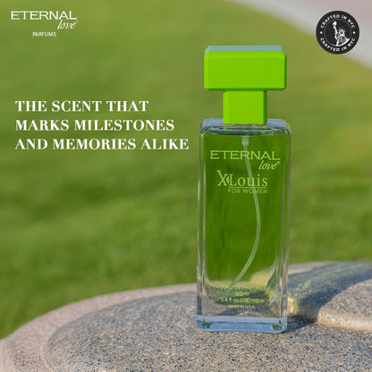 Green perfume bottle labeled 'Eternal Love' by XLouis on a stone surface with grass background