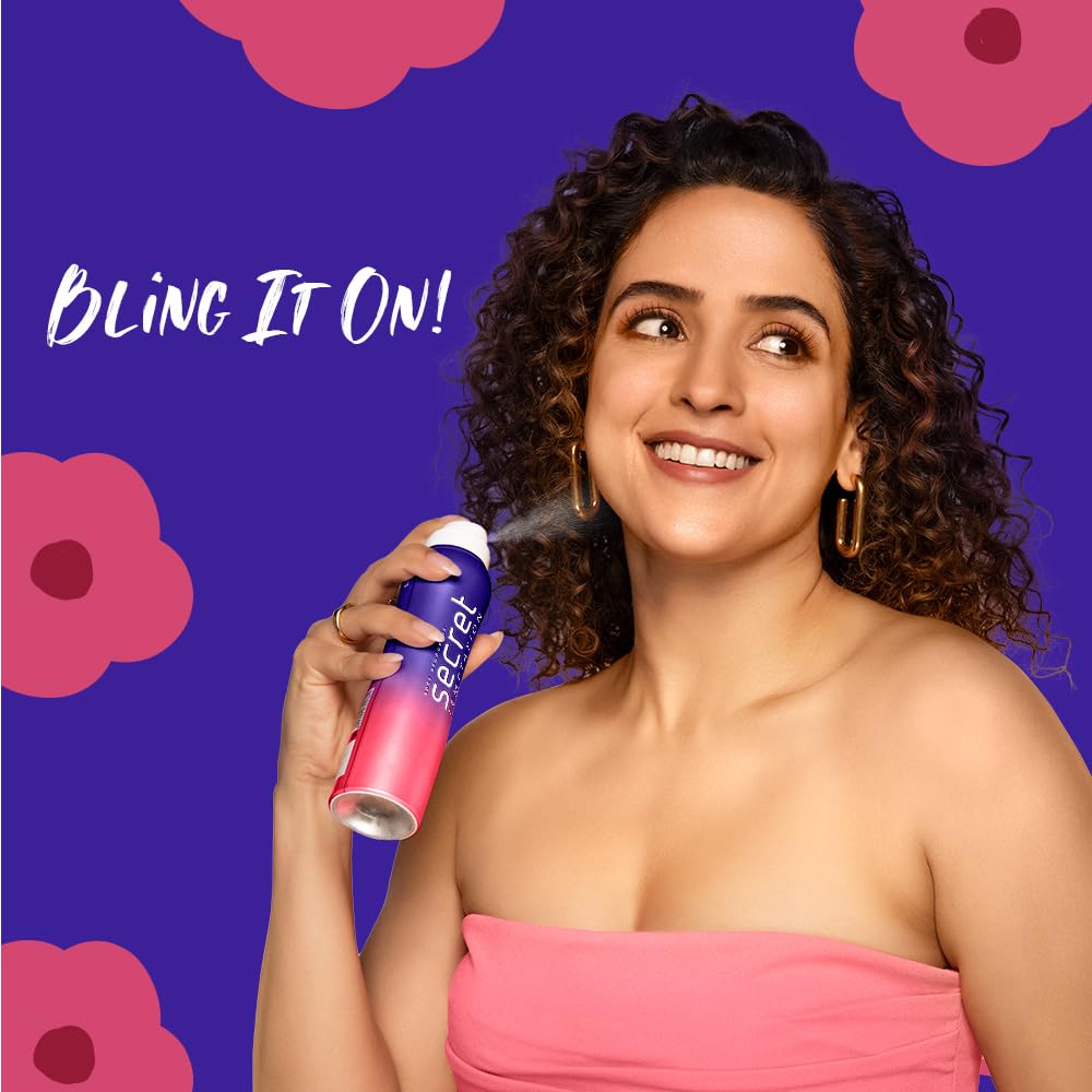 Woman holding a Secret deodorant spray with a colorful floral background