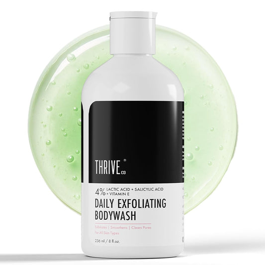 Bottle of Thrive Daily Exfoliating Bodywash with a green gel sample on a white background