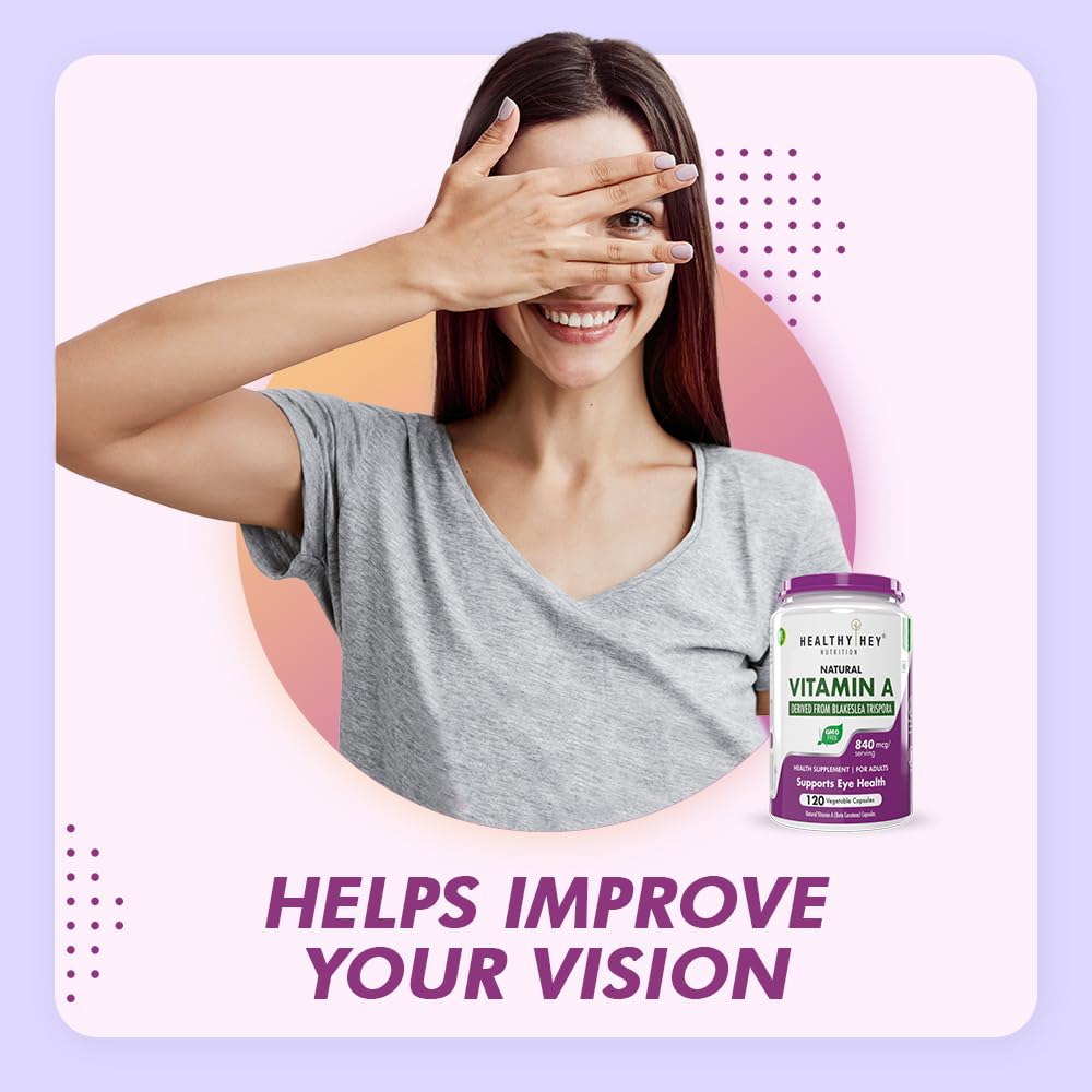 Woman covering her eyes with her hand, next to a bottle of Healthy Hey Vitamin A supplement on a light purple background.