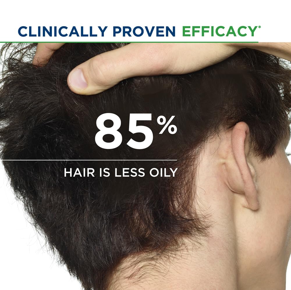 Close-up of a person's head with text indicating clinically proven efficacy and percentage of less oily hair.