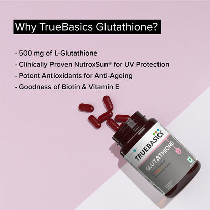 TrueBasics Glutathione supplement bottle with pills on a pink background