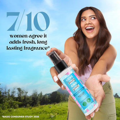 Woman holding a spray bottle with a scenic background and text about fragrance.