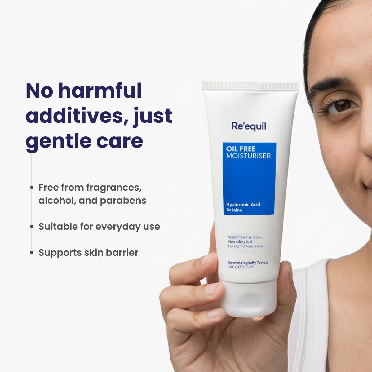 Person holding a tube of Reequil Oil Free Moisturizer with product details on a white background