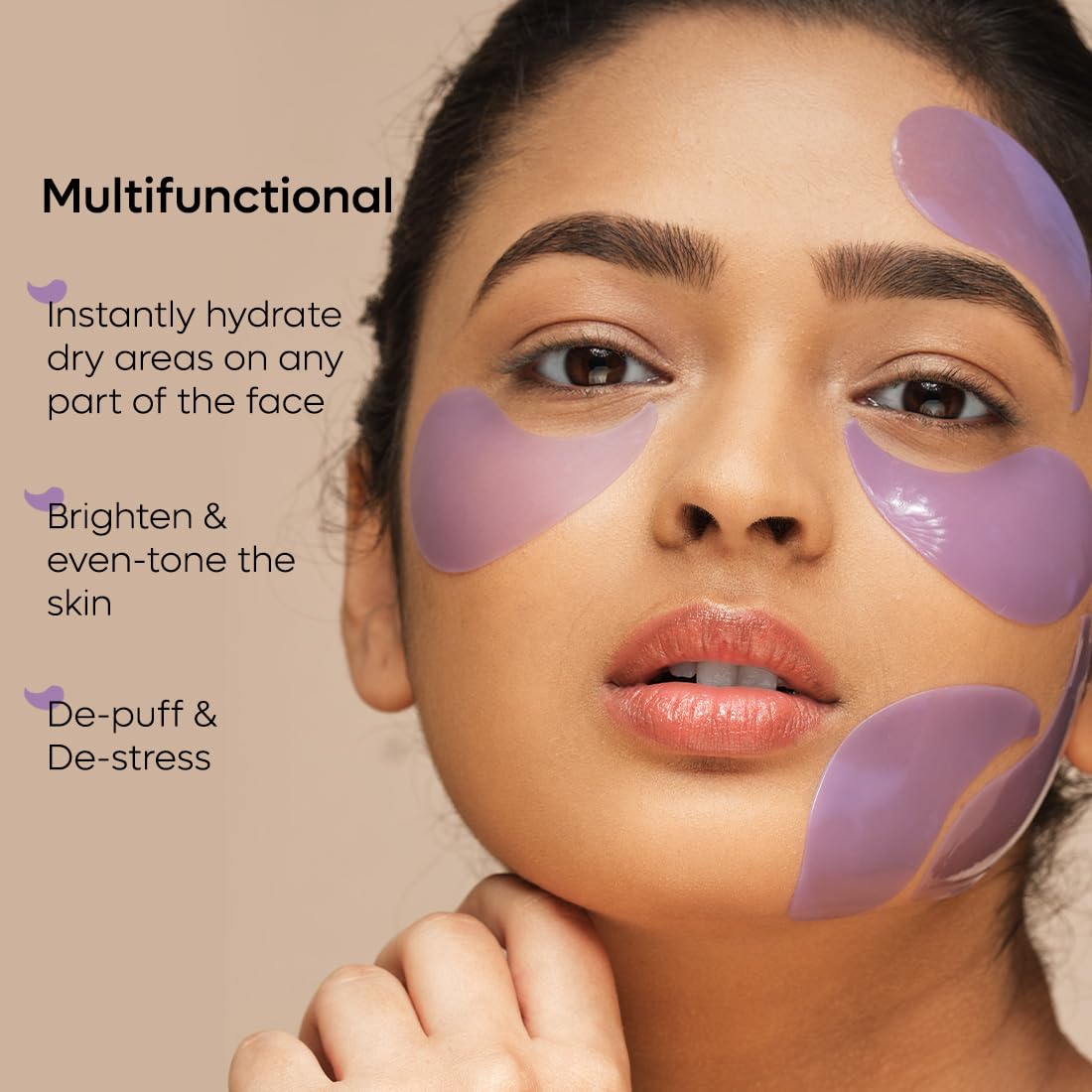 Woman with purple patches on her face against a beige background